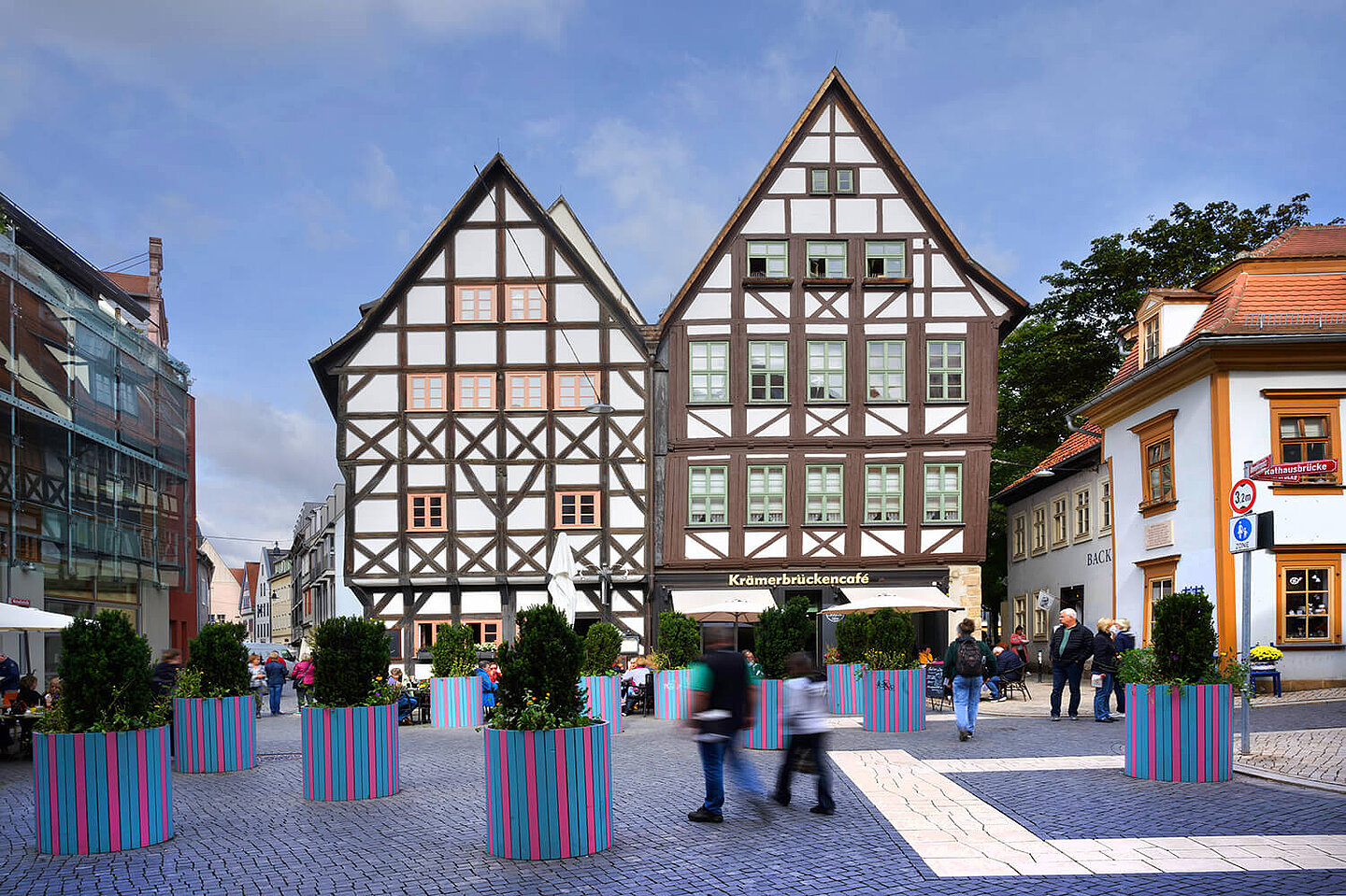 Two old half-timbered houses on the Krämerbrücke, in front of which are planted flower pots